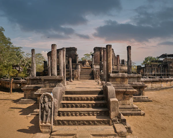 Ancient stone columns and carved steps among the ruins at Polonnaruwa